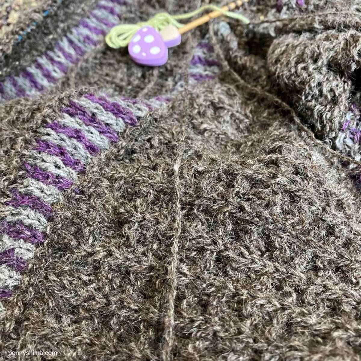 closeup of waffle texture of artus shawl, worked in a medium brown yarn.
