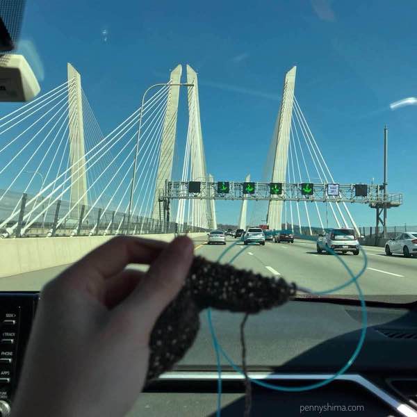 A few rows of the shawl not in focus with the new tappen see bridge and blue skies (heading back to Westchester)
