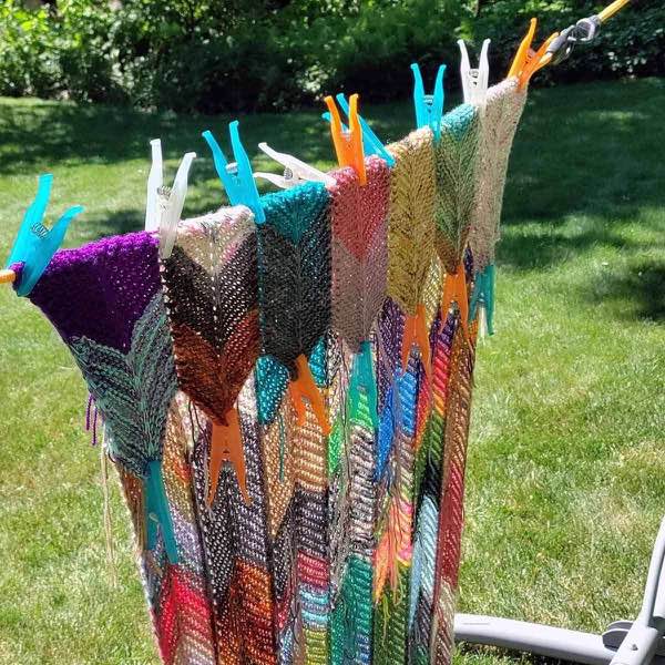 Blanket hanging on a line in the sun with clothes pins helping create the points.
