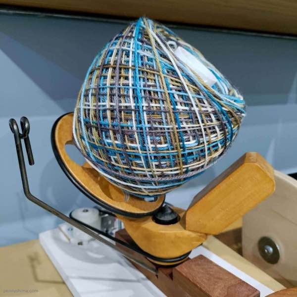 Oink Pigments Targee Sock in "Size of the Boat", caked and shown still on ball winder.