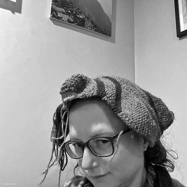 Chicken body on knitter’s head