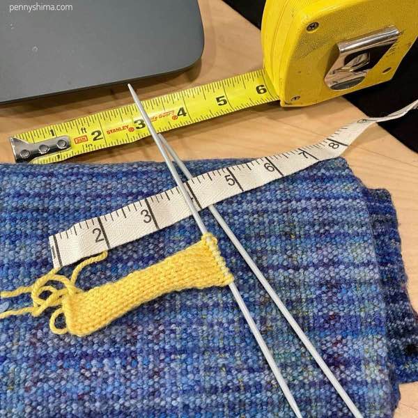 stockinette yellow next to twill tape next to a tape measure