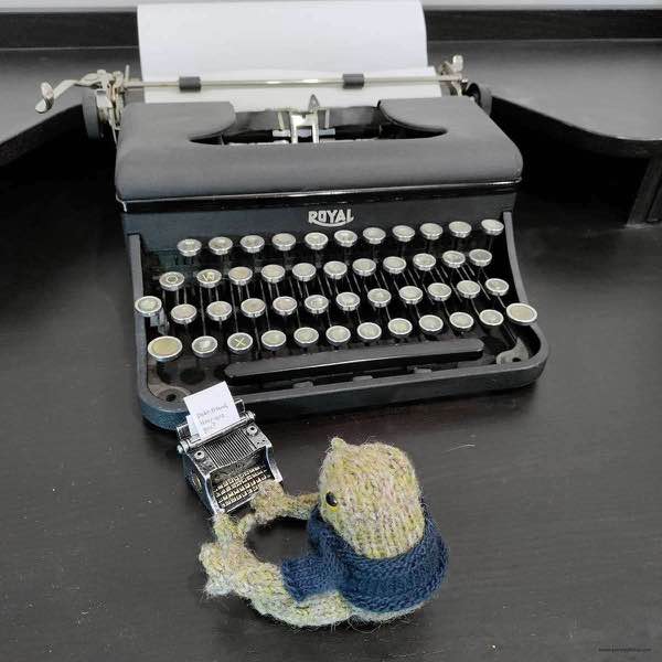 frog typing a letter, "Dear Friend, How are you?" in front of a Royal typewriter