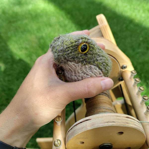she can see, frog in progress with eyes, no legs. Held over a spinning wheel outside