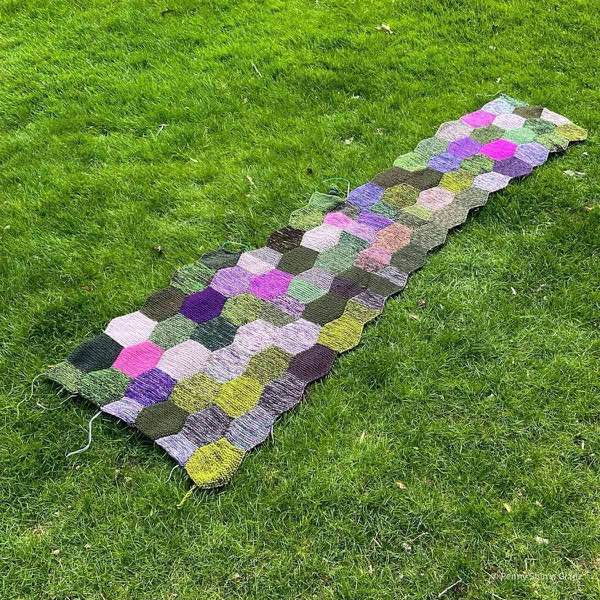 Progress of blanket, shown on a green grass lawn. 4 columns complete, fifth and sixth in progress.