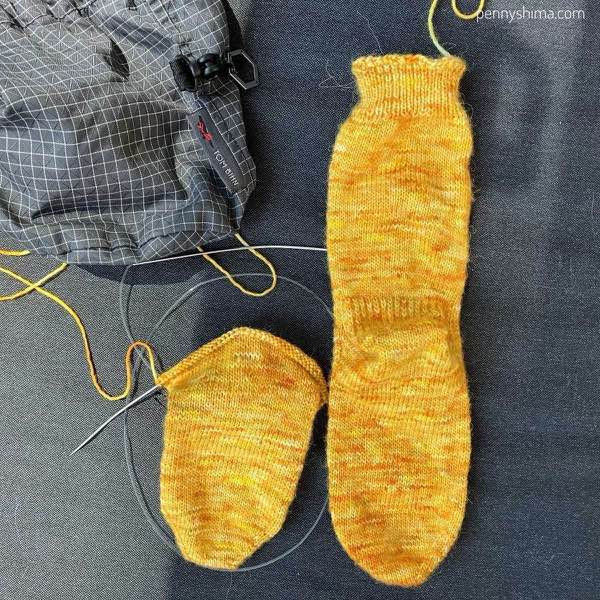 sock in progress with the start of the gusset increases next to the first of the pair.