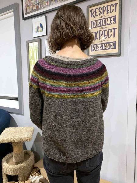 muted rainbow cardigan, unblocked. Fresh off the needles and still needing button band.