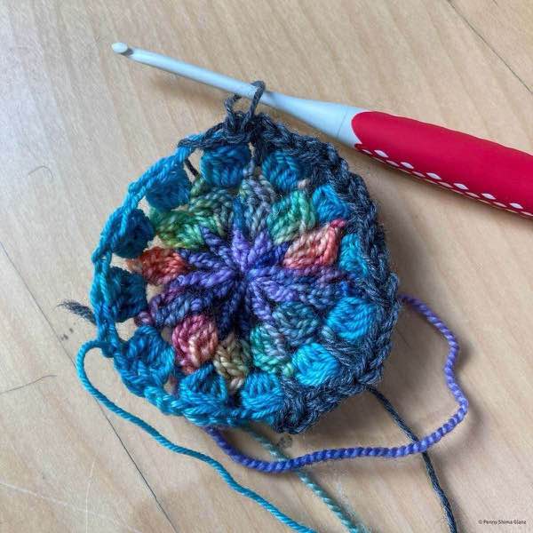 crochet motif in progress. on round 4.