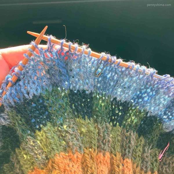 Subtle shifts in sweater yoke color blues being worked.