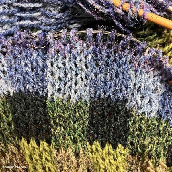 Subtle shifts in sweater yoke color blues being worked.