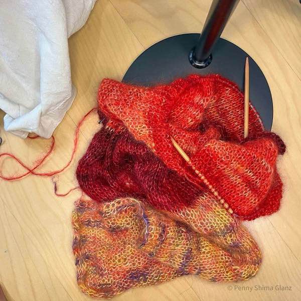 artyarns silk mohair ombre 2ply cardigan in progress sleeve and body of one side shown on a desk