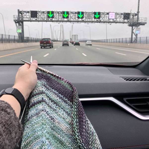 Silky twist poncho held up while heading east on the tappen zee bridge