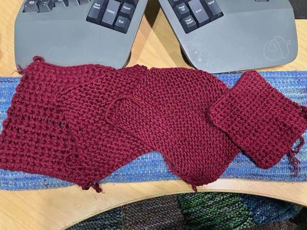 4 swatches laid out overlapping each other diagonally next to a computer keyboard