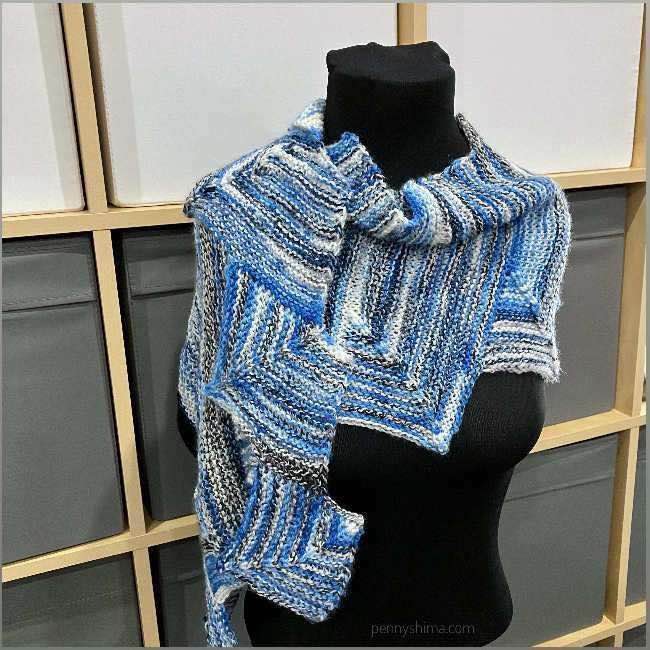 Stairmaster Scarf on a black clad mannequin.